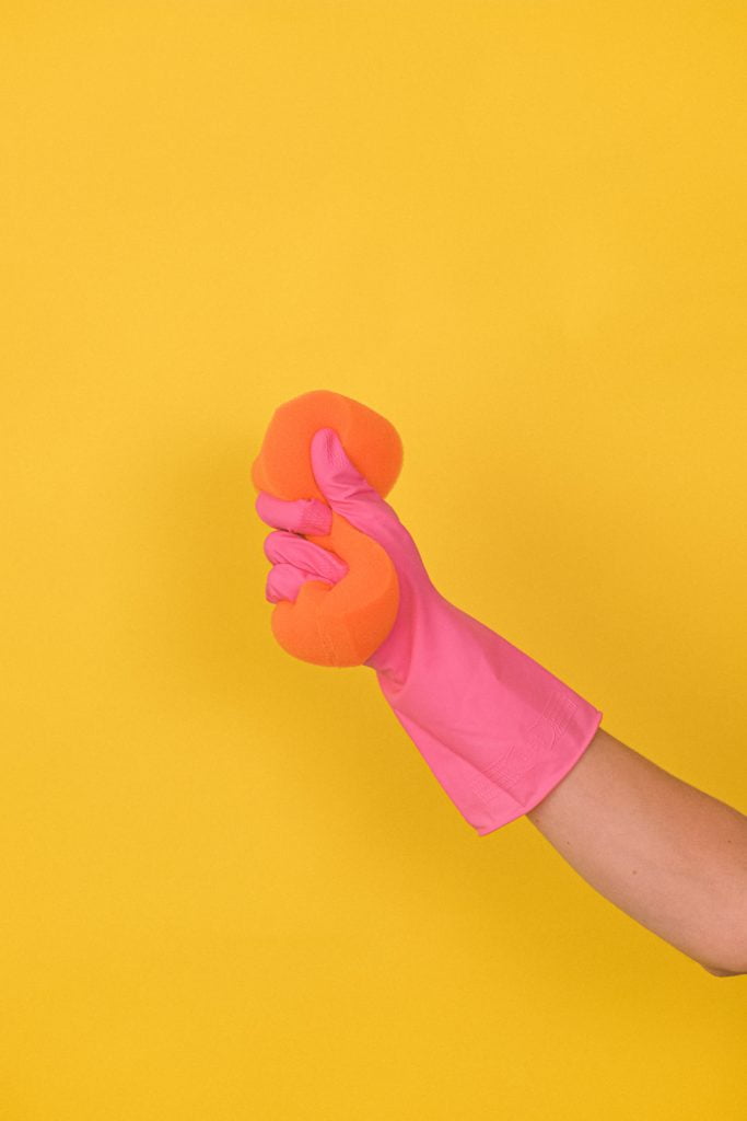 woman holding pink sponge