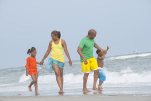 Family walking at the beach